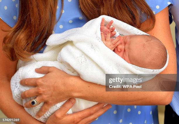 Prince William, Duke of Cambridge and Catherine, Duchess of Cambridge depart The Lindo Wing with their newborn son at St Mary's Hospital on July 23,...