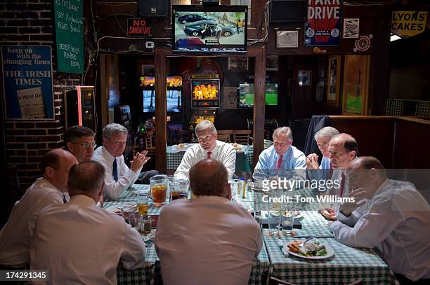 Clockwise from back center, Rep. Jim Matheson, D-Utah, Sens. Richard Burr, R-N.C., Rob Portman, R-Ohio, Reps. Dave Camp, R-Mich., Tom Reed, R-N.Y.,...
