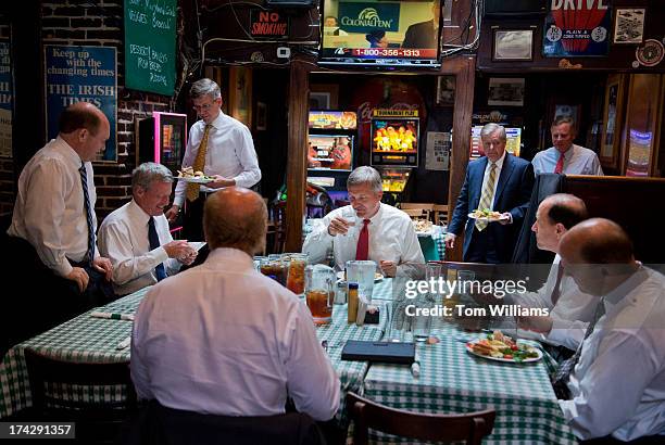 From left, Sens. Chis Coons, D-Del, Max Baucus, D-Mont., Reps. Erik Paulsen, R-Minn., John Delaney, D-Md., Jim Matheson, D-Utah, Lindsey Graham,...