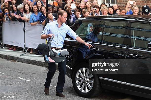 Prince William, Duke of Cambridge leaves the Lindo Wing of St Mary's Hospital with his newborn son on July 23, 2013 in London, England. The Duchess...