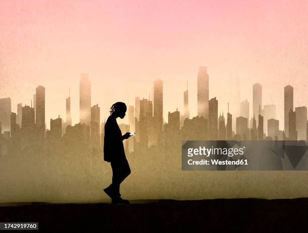 silhouette of teenager walking against city skyline at dusk - city stock illustrations