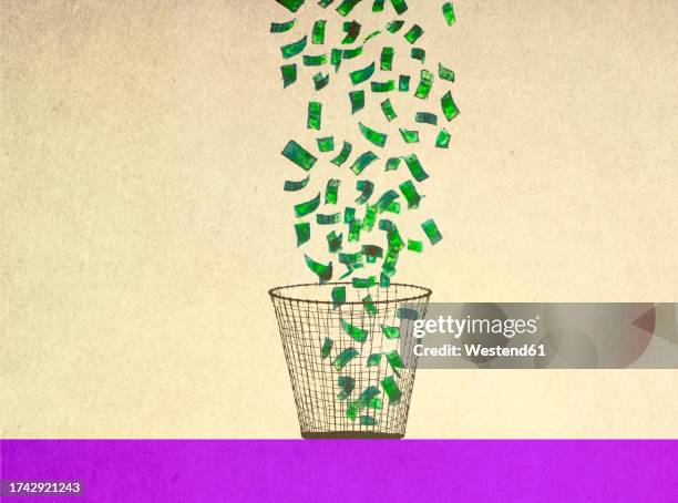 illustration of money falling into wastepaper basket - banknote stock illustrations