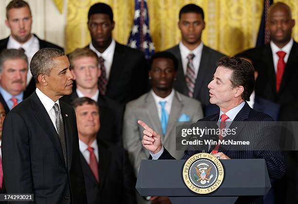 Head coach Rick Pitino speaks with U.S. President Barack Obama during an event honoring the Louisville Cardinals, the 2013 NCAA Men's Basketball...