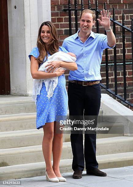 Prince William, Duke of Cambridge and Catherine, Duchess of Cambridge with their newborn son wave to wellwishers before departing the Lindo Wing of...