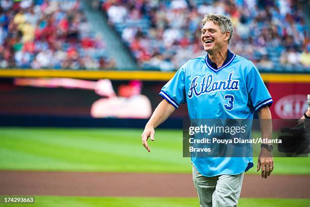 Atlanta Braves former player Dale Murphy throws the ceremonial first pitch before the game against the Cincinnati Reds at Turner Field on July 11,...