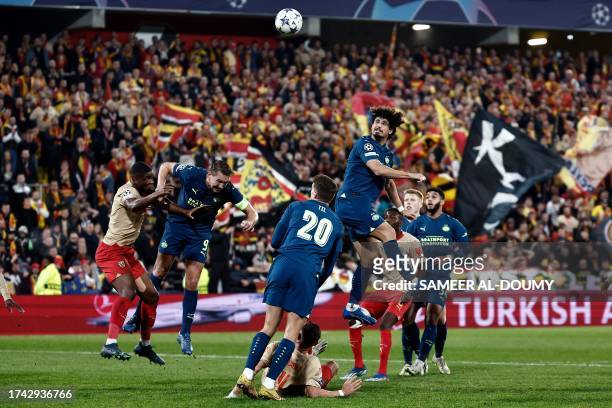 Eindhoven's Brazilian defender Andre Ramalho jumps for the ball during the UEFA Champions League Group B first leg football match between RC Lens and...