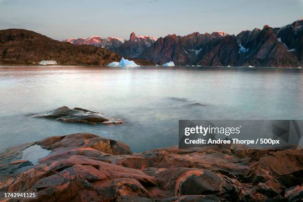 scenic view of lake against sky during sunset - andree thorpe stock pictures, royalty-free photos & images