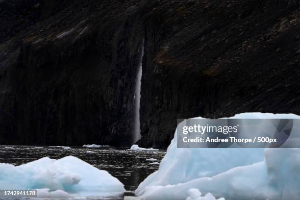 scenic view of frozen waterfall - andree thorpe stock pictures, royalty-free photos & images