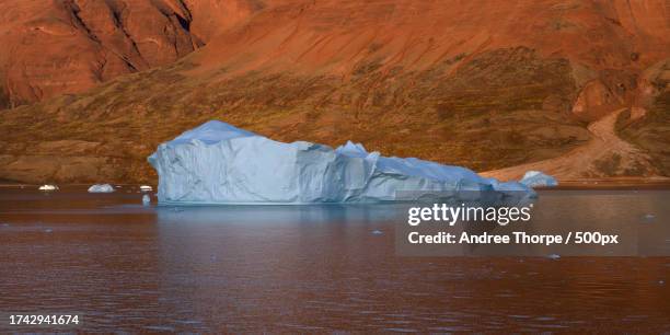 scenic view of lake against mountain - andree thorpe stock pictures, royalty-free photos & images