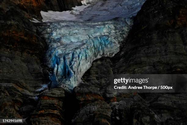 low angle view of rock formation - andree thorpe stock pictures, royalty-free photos & images