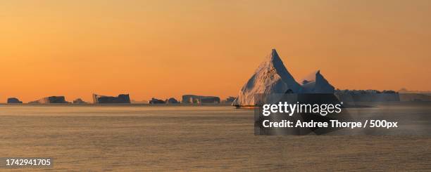 scenic view of sea against clear sky during sunset - andree thorpe stock pictures, royalty-free photos & images