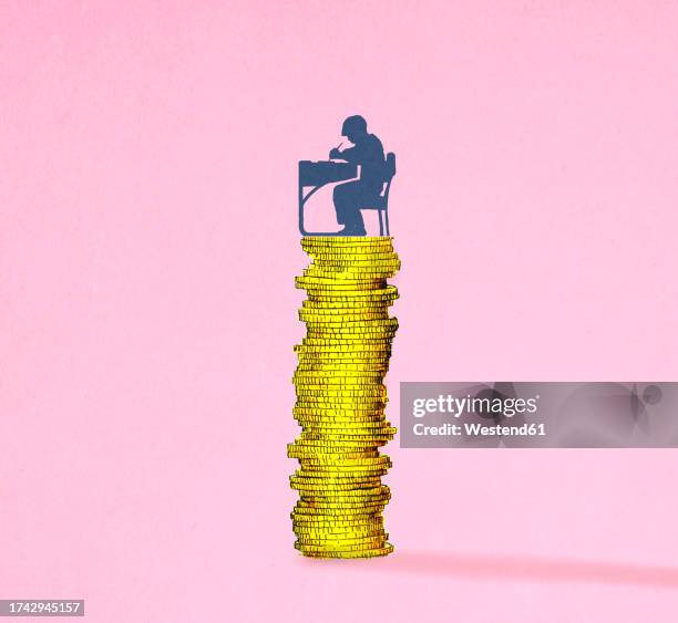 illustration of schoolboy writing at desk balancing on stack of coins symbolizing education costs - coin stock illustrations