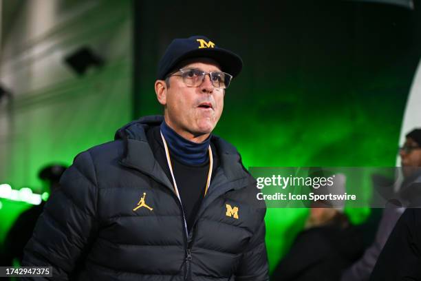 Michigan Wolverines head coach Jim Harbaugh walks through the tunnel prior to a college football game between the Michigan State Spartans and...
