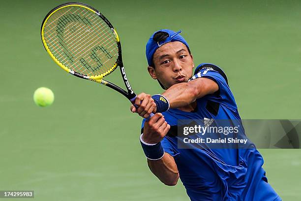 Yen-Hsun Lu of Taipei returns a ball against Kevin King at the BB&T Atlanta Open in Atlantic Station on July 23, 2013 in Atlanta, Georgia. Lu won the...