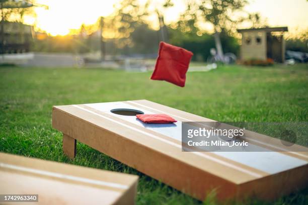 corn hole game - corn hole stock pictures, royalty-free photos & images