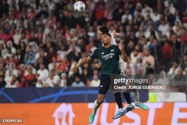 Arsenal's French defender William Saliba vies with Sevilla's Argentinian forward Lucas Ocampos during the UEFA Champions League 1st round day 3 Group...