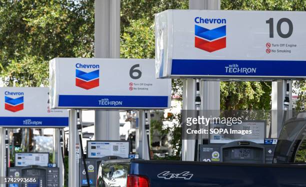 Gas pumps are seen at a Chevron gas station in Orlando. Chevron Corp announced that it has agreed to buy Hess Corporation for $53 billion in stock.