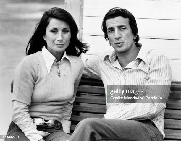 Italian actor Luigi Vannucchi sitting on a bench with his wife Franca Cuoghi. Rome, 1970s.