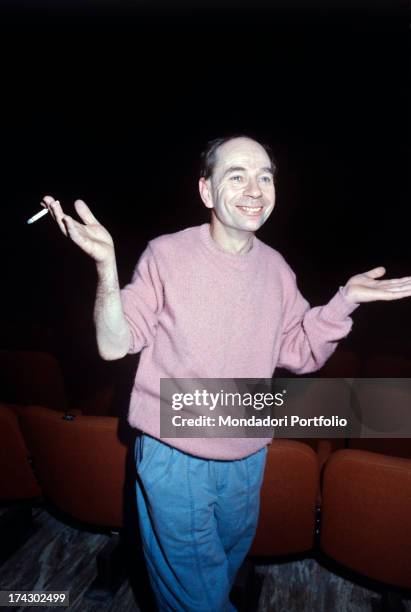 British choreographer, mime and actor Lindsay Kemp smoking a cigarette opening his arms. 1980s.