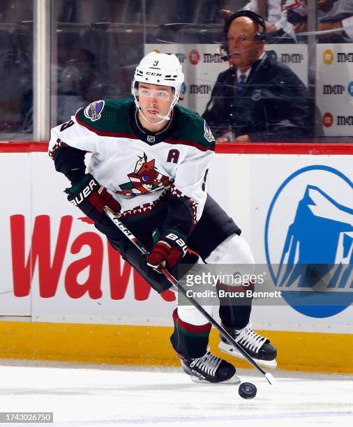 Clayton Keller of the Arizona Coyotes skates against the New Jersey Devils at Prudential Center on October 13, 2023 in Newark, New Jersey.