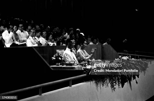 The King of Thailand Bhumibol Adulyadej taking part in a concert with works of Johann Sebastian Bach with his wife, the Queen Sirikit . Bangkok, 1965.