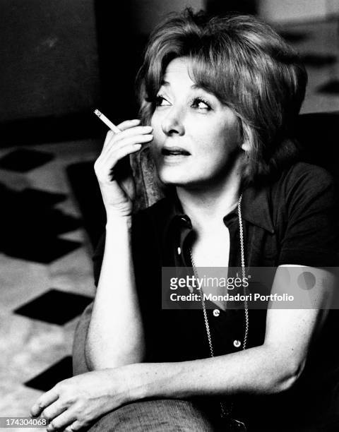 Intense close-up of the Italian film, theatre and television actress Lauretta Masiero with a cigarette in her fingers. Milan , 1972..