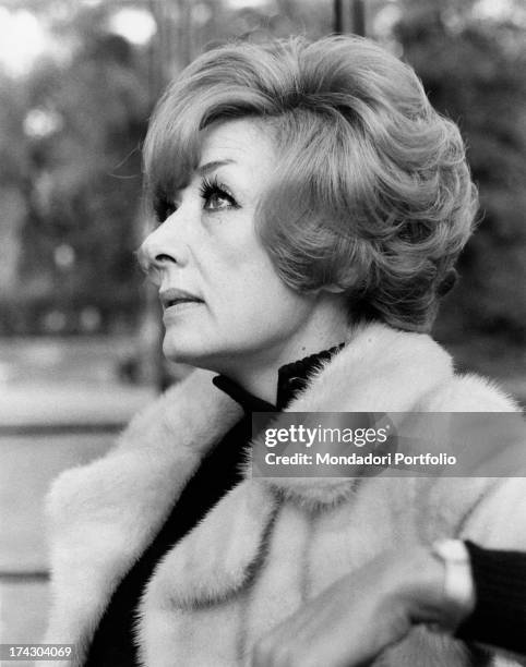 Intense close-up profile of the Italian film, theatre and television actress Lauretta Masiero wearing an elegant light coloured mink coat. Rome ,...