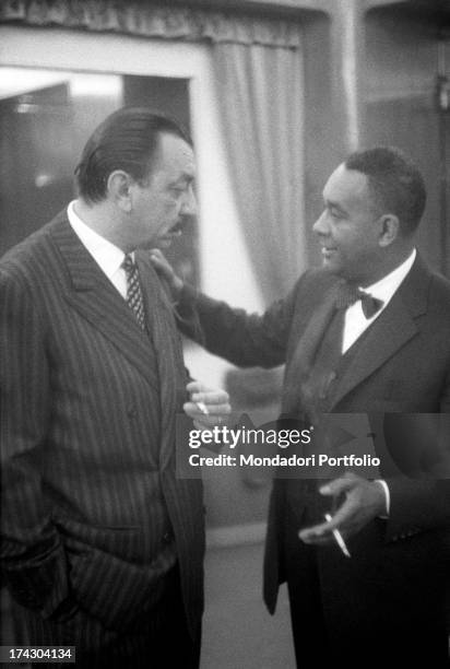 American writer Richard Wright keeping his hand on the shoulder of Italian publisher, journalist and writer Alberto Mondadori. Richard Wright is...