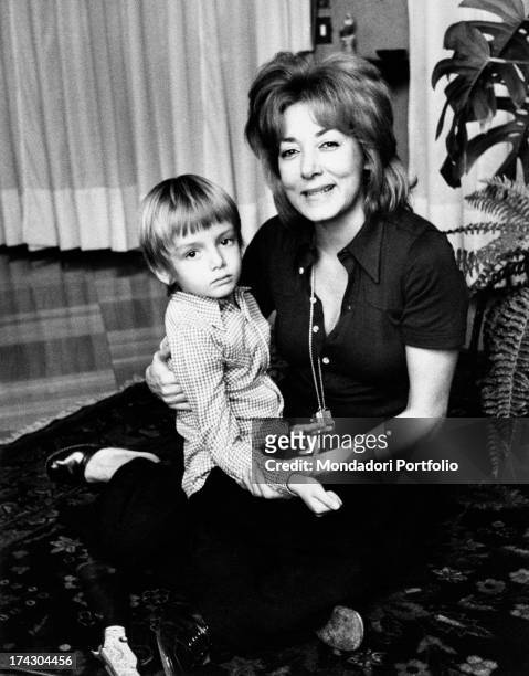 The Italian film, theatre and television actress Lauretta Masiero is smiling with her son Gianluca Guidi in her arms, whose father is the Italian...
