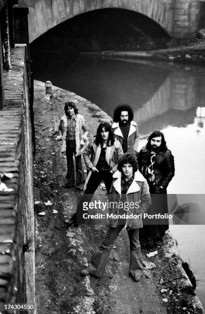 The Italian melodic rock band I Camaleonti is posing along the canals of Milan; the band is composed again of five elements with the musician Dave...