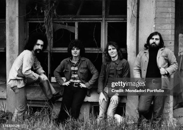 The Italian melodic rock band I Camaleonti are posing in front of a ruined farmhouse in the province of Milan: from left, Livio Macchia , Antonio...