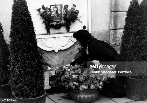 Lilian Sacchi takes some flowers to the tomb of her husband Carlo, shot dead with a 9mm caliber revolver by his lover, Pia Bellentani, on the 15th...