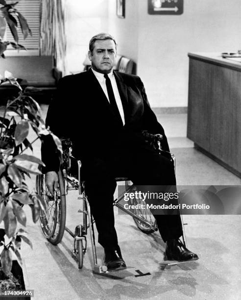 Canadian-born American actor Raymond Burr sitting on a wheelchair. He acts in the TV series Ironside. 1970.