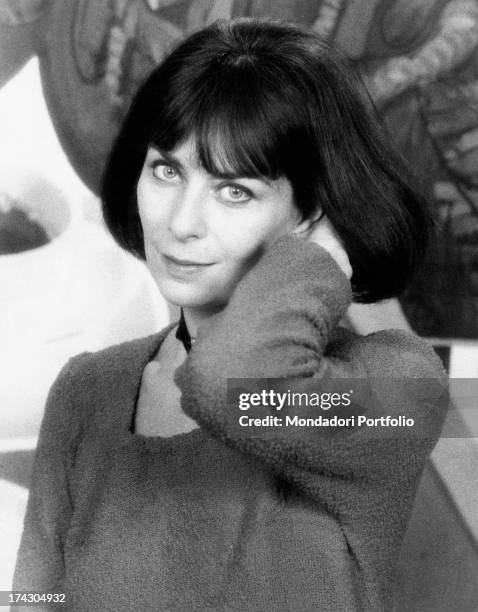 Portrait of French actress Juliette Mayniel with a hand in her hair. Rome, 1970s.