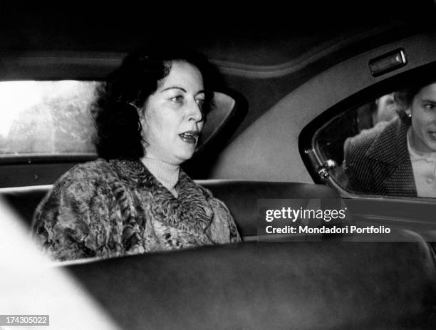 The Countess Pia Bellentani sitting on the back seat of a car to go home to Sulmona. She is coming out from the psychiatric hospital where she was...