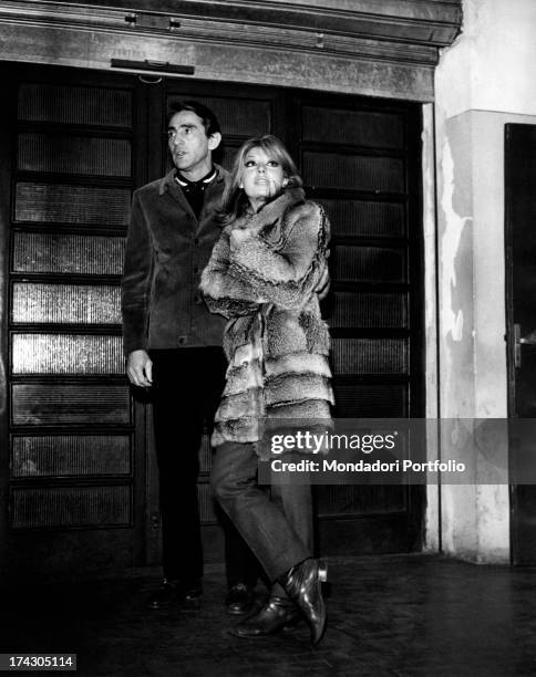 The actor and comic Walter Chiari with his wife Alida Chelli, in a fur coat. Turin , January 1968..