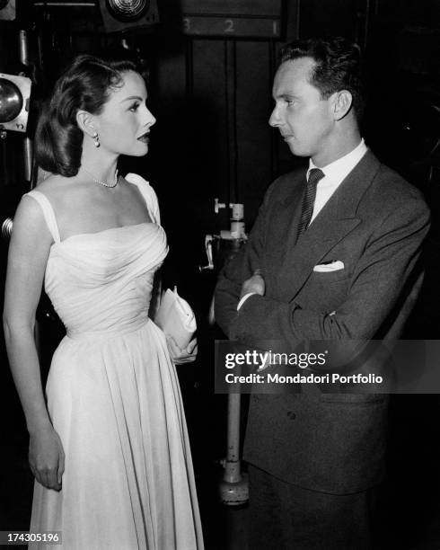 Italian-German prince and stage designer Heinrich of Hesse-Kassel looking into the eyes American actress Jeanne Crain. 1950s.