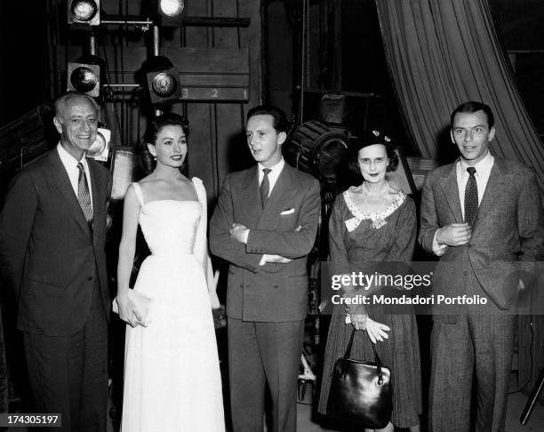 Italian-German prince and stage designer Heinrich of Hesse-Kassel, American actress Jeanne Crain and America singer and actor Frank Sinatra posing...