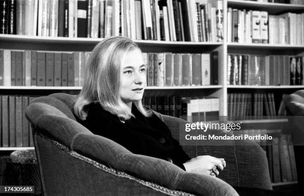 Marisa Malagoli Togliatti sitting on an armchair. Marisa is Palmiro Togliatti and Nilde Iotti's adopted daughter. Rome, 1964.