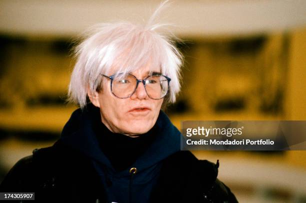 Portrait of the American great artist and guru of Pop Art movement Andy Warhol, born Andrew Warhola Junior, with his typical hairstyle. Italy, the...