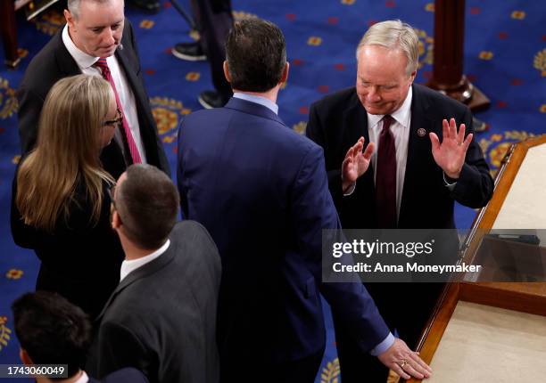 Rep. David Joyce talks to fellow lawmakers as the House of Representatives holds a vote on a new Speaker of the House at the U.S. Capitol on October...