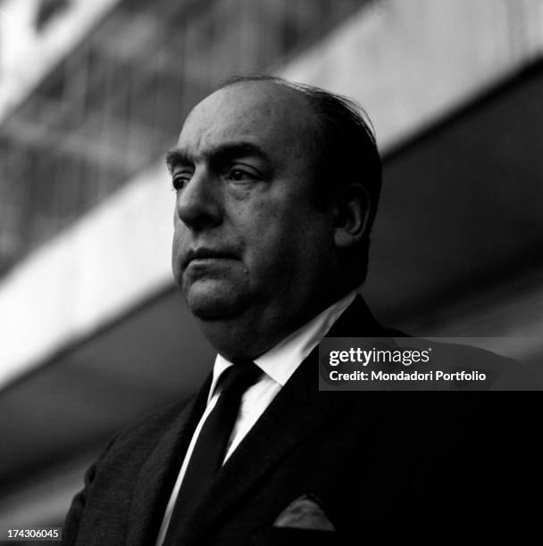 Three-quarter face portrait of a thoughtful Pablo Neruda, whose real name is Ricardo Eliezer NeftalÌ Reyes Basoalto, during a reading of his poems by...