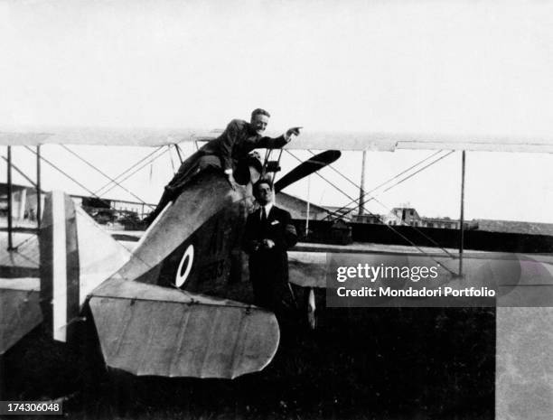 Italian pilot Mario De Bernardi posing beside an Ansaldo A1 Balilla fighter aircraft with Italian sergeant and pilot Franz Almerigi. Collegno, 1917.