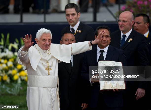 Pope Benedict XVI waves next to the Governor of Guanajuato State, Juan Manuel Oliva , during a ceremony in which he will be given the keys of the...