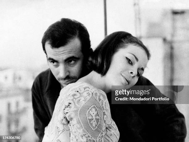 Italian Princess Maria Beatrice of Savoy leaning her head on the shoulder of Italian actor Maurizio Arena . Ostia, October 1967.