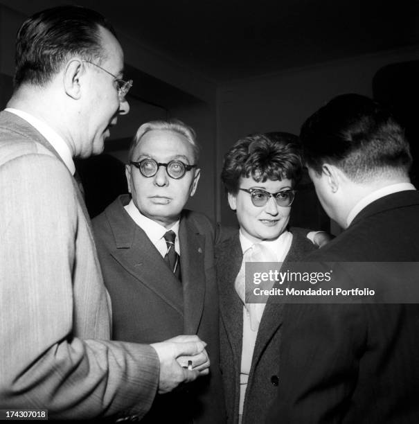 Well-known figures of the world of music are chatting at the IV Sanremo Music Festival in the Casinò of Sanremo: from left, the journalist Alfredo...