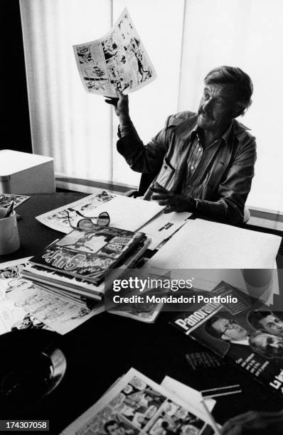 American comic-strip writer and publisher Stan Lee showing a comic strip. 1970s.