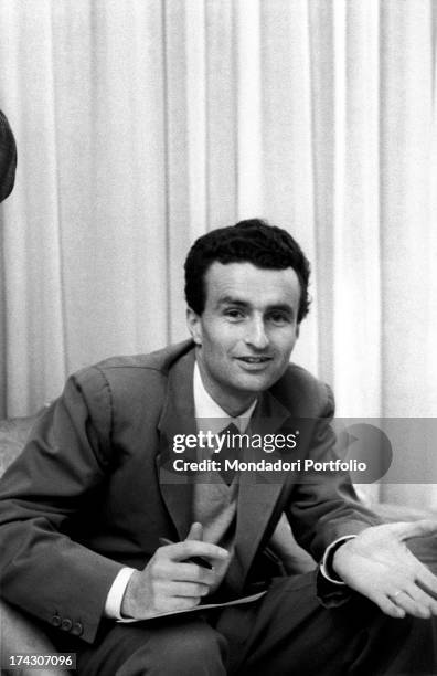 The actress Jane Loncada's husband is smiling at the photographer in the living-room of the Italian director Pasquale Festa Campanile, during a...