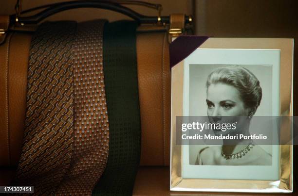 Mourning photography of Grace of Monaco exposed in a shop of articles for men during the funeral of the Princess; on the left, three ties posed on a...