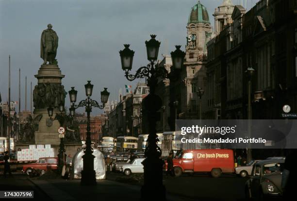 View of one of the main streets of Dublin, O'Connell Street, plunged into traffic jam; on the left, the huge statue of Daniel O'Connell, referred to...